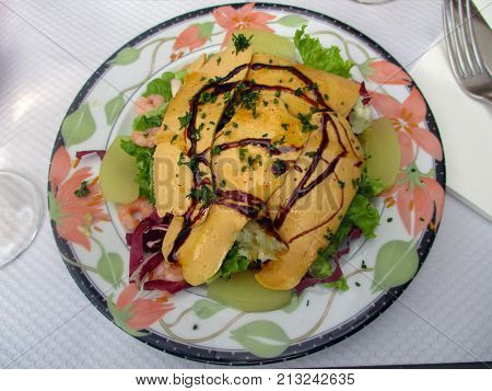 Salad Foie gras Foie Gras with pears and shrimps, French recipe.
