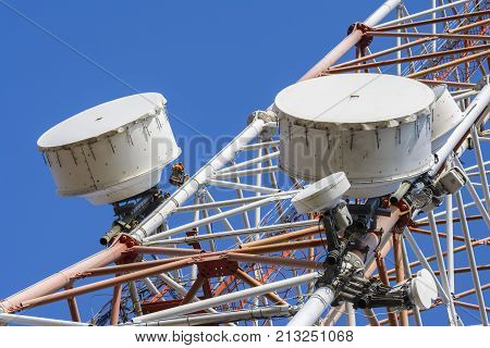 Tower with communication antennas with receptors and emitters.