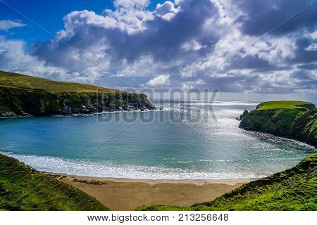 A stunning crescent shaped beach in Glencolmcille Ireland.