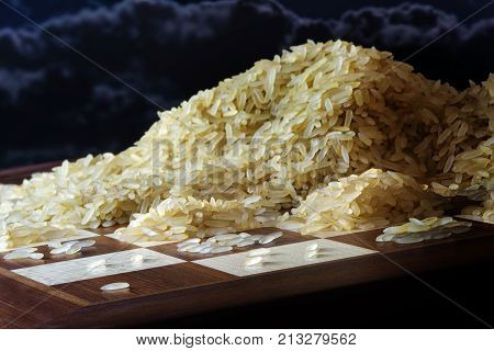chessboard with growing heaps of rice grains legend about the exponential function and the limits to growth dark sky selected focus narrow depth of field