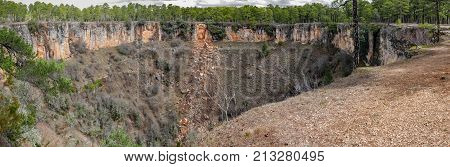 Wide panorama of round deep wolf torca in palancares, Cuenca
