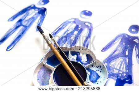 Abstract people made of watercolour  palette and artist brushes