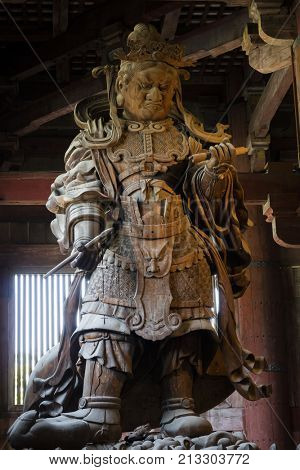  Nara, Japan -  May 29, 2017: Wooden statue of  Komokuten guardian watching over Todaiji Temple and its precincts 