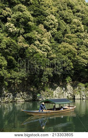 Kyoto, Japan - May 20, 2017: A wooden boat on the Katsura River at Otsuki, Yamanashi