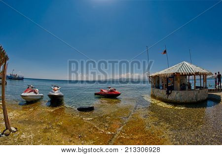 SEVAN LAKE, ARMENIA - 02 AUGUST 2017: Beach and Watersports Boats at Mountain Lake of Sevan in Armenia