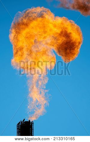 Combustion of associated petroleum gas.
Associated gas, is a form of natural gas which is found with deposits of petroleum.