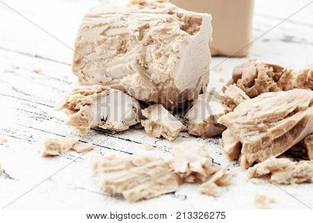 Dry yeast crumbled and yeast block for baking.
