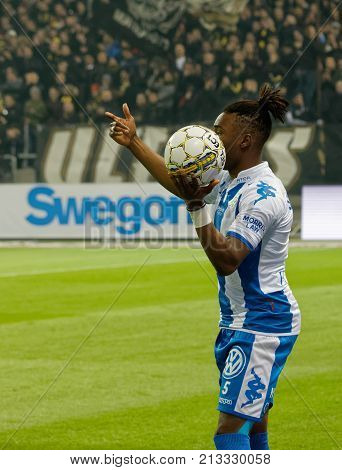 SOLNA SWEDEN - OCT 30 2017: Soccer player making a throw-in. Robert Taylor (AIK) have the ball under control. October 30 2017SolnaSweden