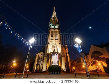 Mariacki church with angel in christmas night. Katowice Poland. Europe.