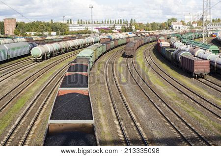 rail cars loaded with coal, a train transports coal. Many different rail cars