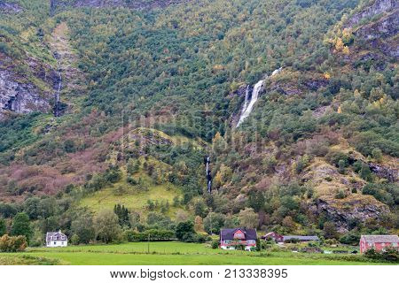 Flam is a village in Flamsdalen at the inner end of the Aurlandsfjorden a branch of Sognefjorden. The village is located in the municipality of Aurland in Sogn og Fjordane county Norway.