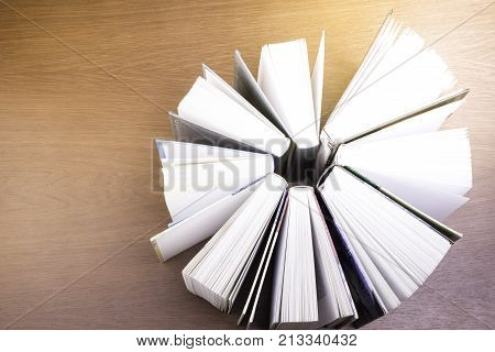 stack of old books on a table to the library.