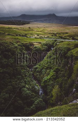 Lealt falls in the Isle of Skye scotland on a dark stormy day