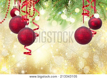 Red christmas balls and evergreen fir tree on blue winter background