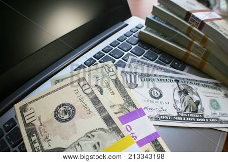 Online Money With Stacks Of Money On Laptop Keyboard High Quality