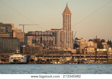 Smokey skies and sunset highlight Seattle's Smith Tower and Washington State Ferry Kaleeten