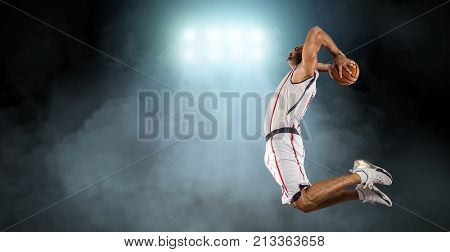Caucassian Basketball Player in dynamic action with ball in a professional sport game
