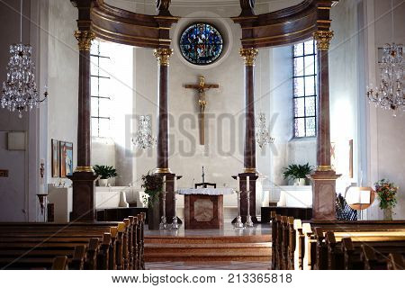NIEDER-OLM, GERMANY - OCTOBER 14: The altar and interior of the Catholic parish church of St. Georg on October 14, 2017 in Nieder-Olm.