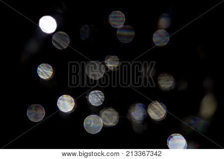 out of focus light reflections on black background