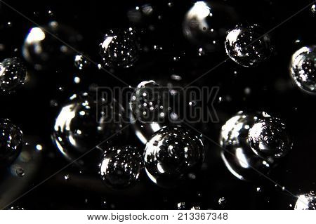 lots of bubbles in glass with black background