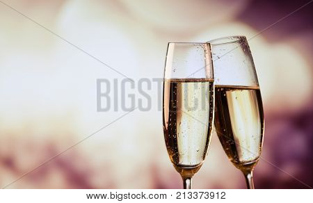 two champagne glasses ready to bring in the New Year