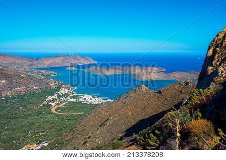 Panoramic view of the gulf of Mirambello with Spinalonga island. View from the mountain of Oxa with ruins of ancient water tanks, Crete, Greece.