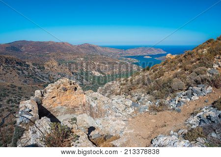 Panoramic view of the gulf of Mirambello with Spinalonga island. View from the mountain of Oxa with ruins of ancient water tanks, Crete, Greece.