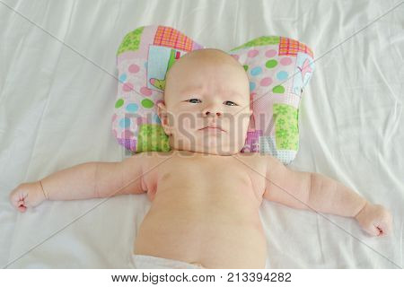Baby On The Orthopedic Pillow
