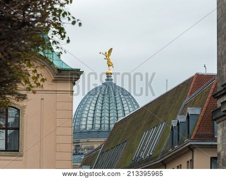 Dome with golden figure of Kunstakademiein Dresden Germany