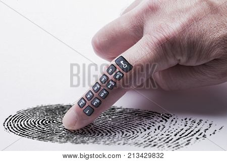 Digital finger print concept for online identity protection showing a finger with a keypad pressing on a finger print mark. White background