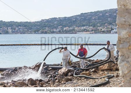 Greece. Salamis Island. November 5 2017. Workers continue to remove oil that spilled from the tanker Agia Zoni sunk in the Saronic Gulf. Environmental disaster .