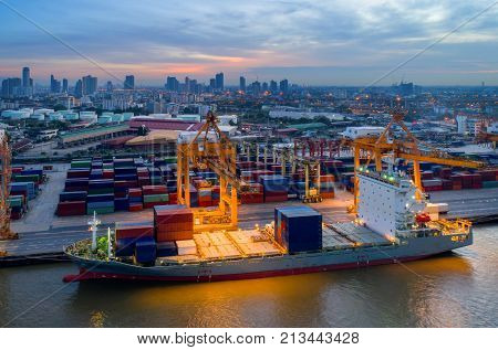Containers yard in port congestion with ship vessels are loading and discharging operations of the transhipments in international port.