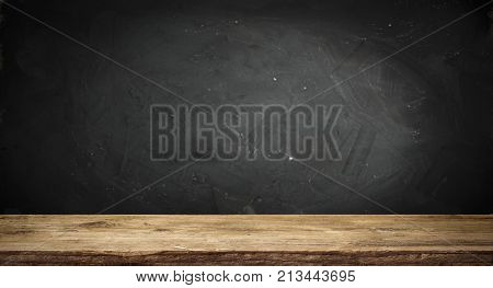 Old wood table top with smoke in the dark background