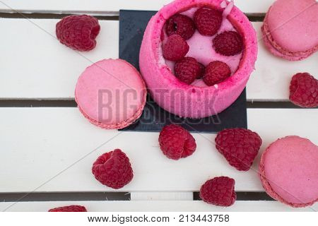 Rasperry charlottemacaroons raspberry berries on a tray of white boards