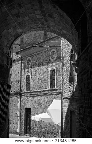 Recanati (Macerata Marches Italy): typical buildings of the historic town. Street. Black and white