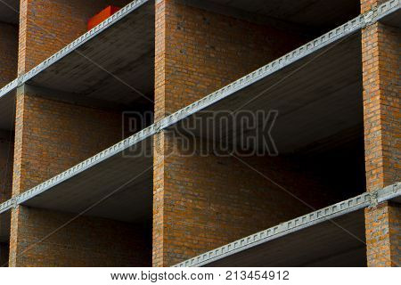 Floors. Fragment of the wall of the unfinished building.