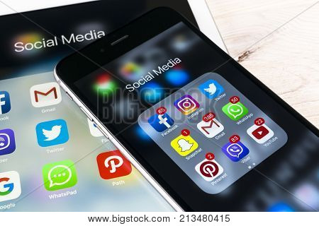 Sankt-Petersburg Russia November 13 2017: Apple iPhone 7 and iPad pro with icons of social media facebook instagram twitter snapchat application on screen. Smartphone Starting social media app.