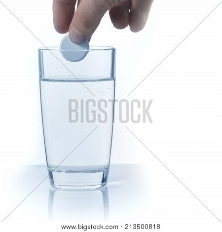 Closeup of effervescen tablet aspirin in glass of water Toned