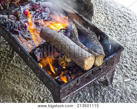 making Turkish kebabs, making cag kebabs, cooking meat on barbecue