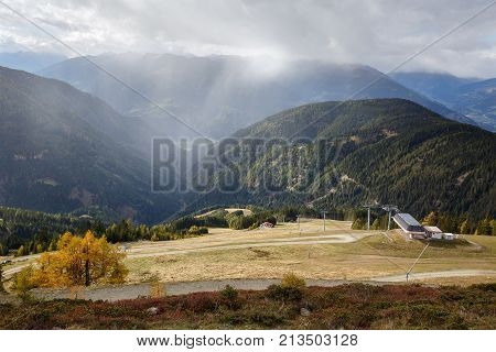 Autumn mountain landscape. Baernbissbahn cable car station on the ski resort Goldeck. The Alps mountains, Carinthia, Austria.