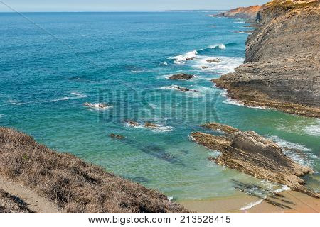 Beach with rocks in Praia do Cavaleiro in Alentejo Portugal
