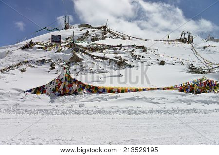 Prayer flags on the mountain after snowing