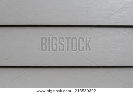 Close Up of Three Gray Siding Boards Baxkground