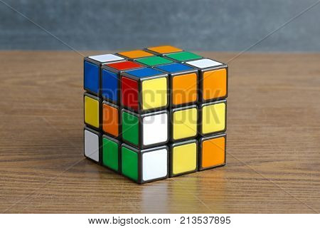 BUDAPEST, HUNGARY - MAY 1, 2016: Unsolved Rubik's cube logic game on white studio background