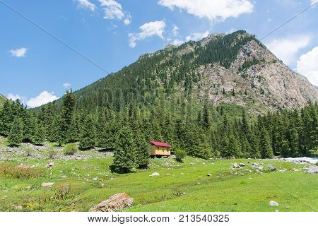 Cabin near mountains and forest (sky, cloud, highlands)