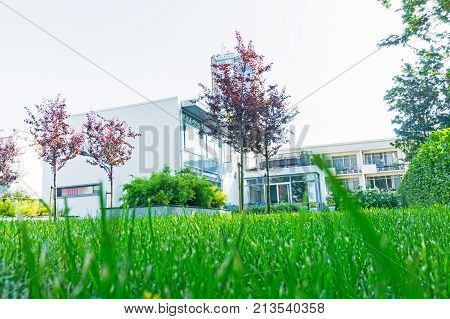 ROTTERDAM HOLLAND- AUGUST 23 2017; Low point of view lawn and gardens of historic 1930's residence known as Sonneveldt House preserved in it original art deco style as a museum