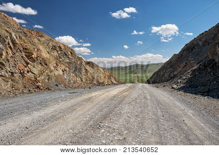 View On Road, Mountains And Sky With Clouds From  The Obotyn-daba Mountain Pass