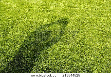 The Shadow Of Player Trow The Soccer Football On The Artificial Grass Soccer Field.