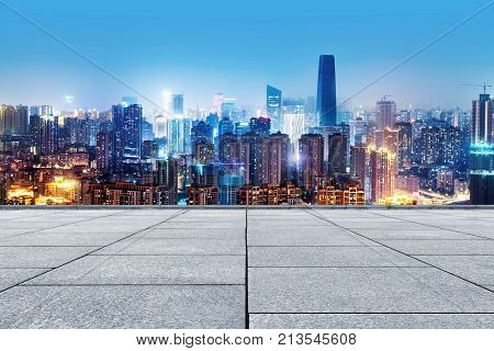 Empty marble floor and city skyline China Chongqing night view.