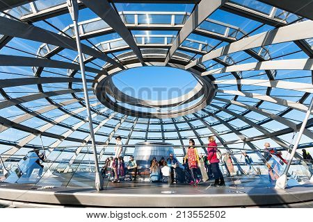 Tourists On Excursion In Reichstag Dome In Berlin